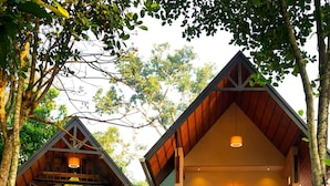 A two-story building with a balcony and a staircase leading to the upper floor. - Casa Bella (Peermade)