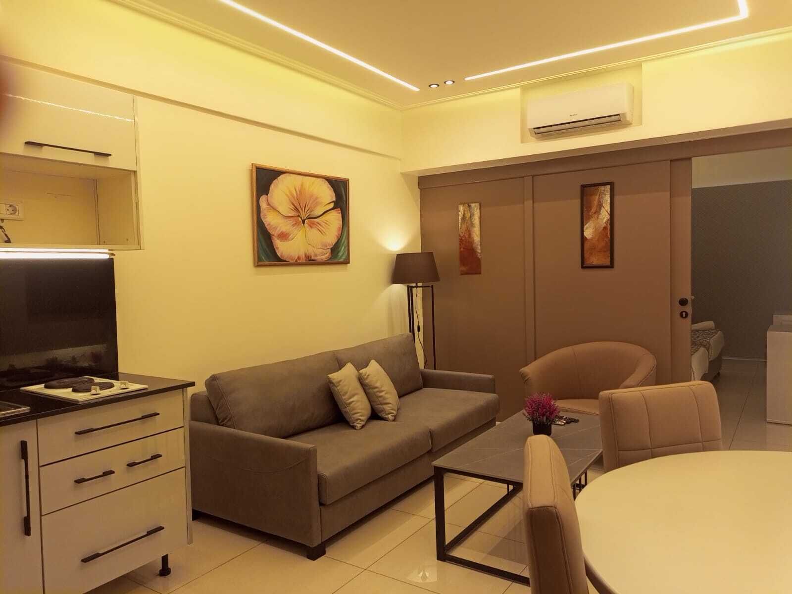 Business Studio Suite | Living area | 40-inch LCD TV with satellite channels
