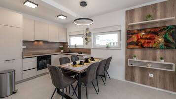 Deluxe Apartment, 3 Bedrooms, Pool Access, Sea View | Private kitchen | Full-size fridge, oven, stovetop, dishwasher