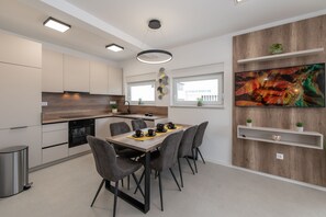 Deluxe Apartment, 3 Bedrooms, Pool Access | Private kitchen | Full-size fridge, oven, stovetop, dishwasher
