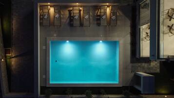 Seasonal outdoor pool, open 9:00 AM to 9:00 PM, sun loungers