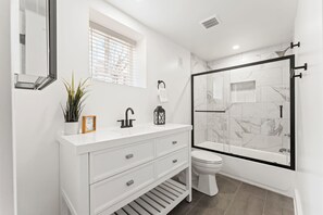 Shower, hair dryer, towels