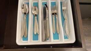 A drawer with compartments containing silverware including spoons, forks, and knives. - Dt 1Bed 1bath Cozy Suite 8 Min Walk To Arena (Edmonton)