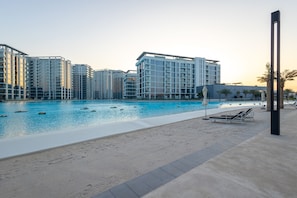 Outdoor pool - SuperHost - Serene 1BR in District One With Artificial Beach (Dubai)