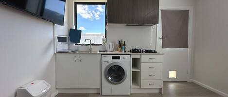 Fridge, microwave, toaster, cookware/dishes/utensils