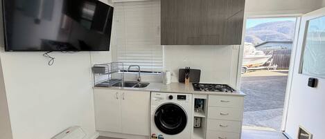 Fridge, microwave, toaster, cookware/dishes/utensils