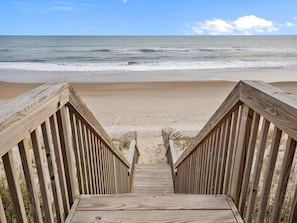 A wooden staircase leading to a sandy beach with the ocean in the background. - A Shore Thing - 6BR Oceanfront House in North Topsail - Sleeps 16 (North Topsail Beach)