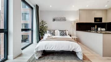 Appartement Deluxe, 2 chambres | Coin séjour | Télévision à écran plat