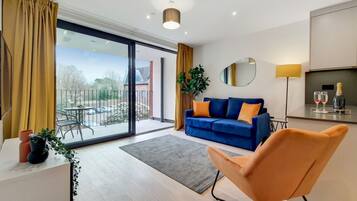 Appartement Deluxe | Coin séjour | Télévision à écran plat