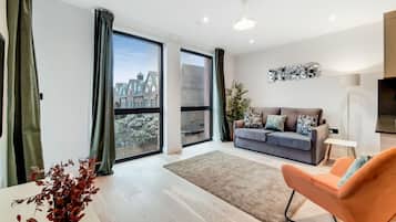 Deluxe Apartment, 2 Bedrooms | Living area | Flat-screen TV