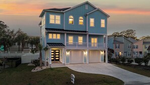 A two-story house with a front porch and a garage.