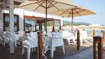 Private beach, white sand, sun-loungers, beach umbrellas