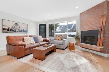 Large living area with views of the slopes