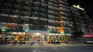 A multi-story hotel with balconies, a ground entrance, and a sign reading "Zephyr Grand Hotel". - Zephyr Grand Hotel (Patong)