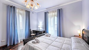A hotel room with a bed, a desk, a chair, and a chandelier. - Beautiful Villa With Private Spa (Alviano)