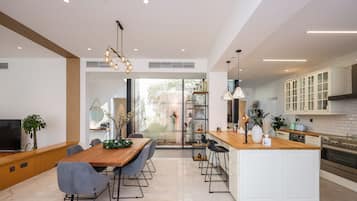 Deluxe Villa | Private kitchen | Fridge, microwave, oven, dishwasher