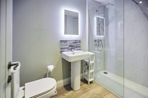 Shower, hair dryer, towels, shampoo