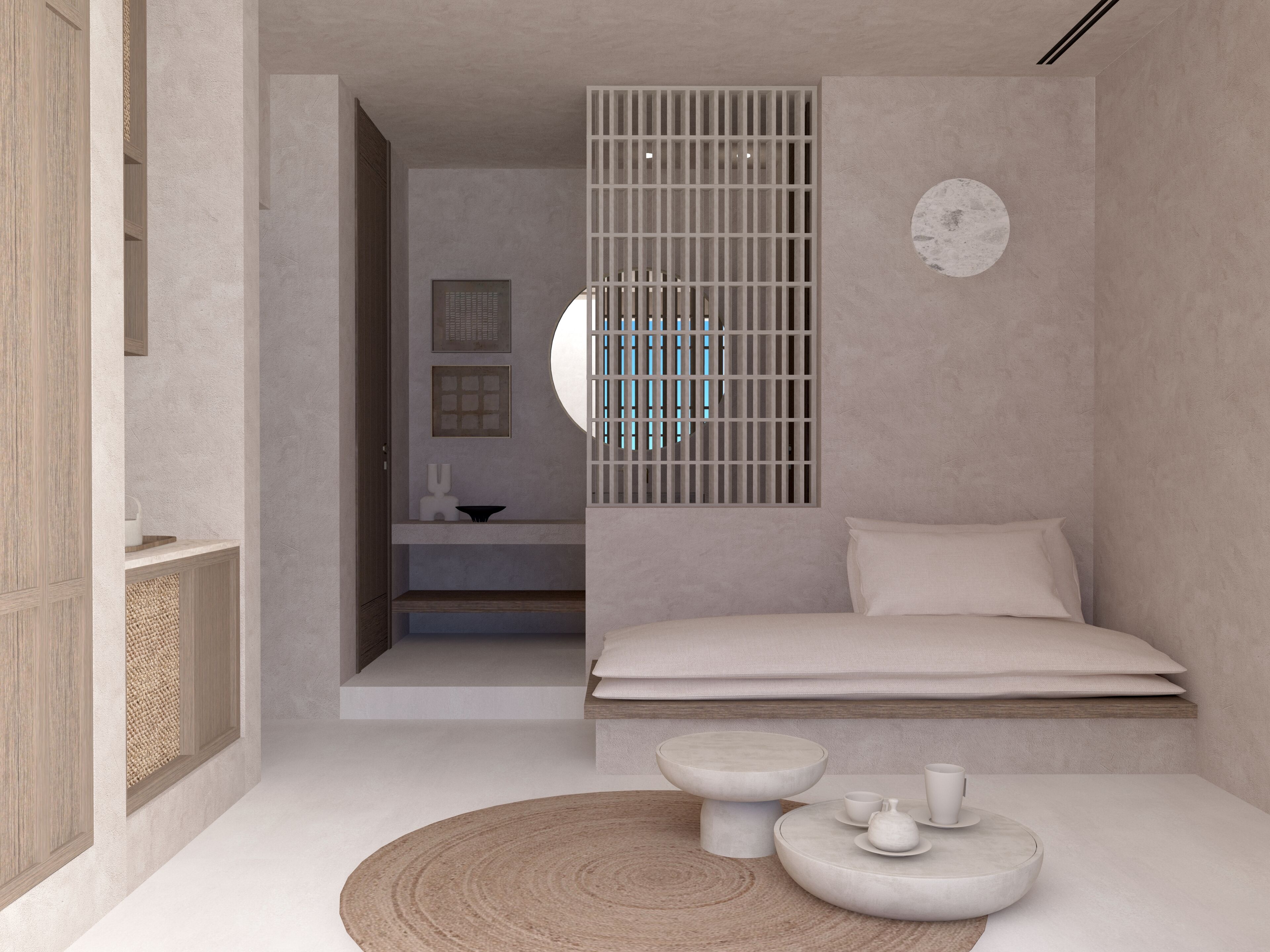 Een minimalistische slaapkamer met een bed, nachtkastjes en een rond tapijt.