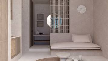Een minimalistische slaapkamer met een bed, nachtkastjes en een rond tapijt.