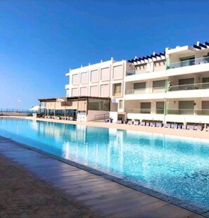 Outdoor pool, a heated pool - Beautiful Appart Agadir Aourir: Feet in the water!!! (Agadir)