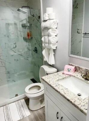 Shower, hair dryer, towels, soap