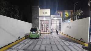 A gated entrance to a building with a sign reading "AN NUR HOMESTAY Syanah". - Capital O 93489 An Nur Homestay Syariah (Mungkid)