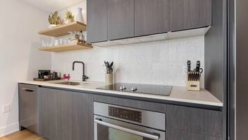 Luxury Condo | Private kitchen | Full-sized fridge, microwave, stovetop, dishwasher