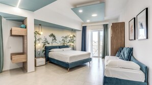 A modern bedroom with a bed, a desk, and a chair. - National Square Napoli (Naples)