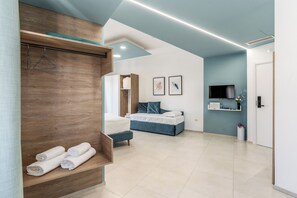 Chambre quadruple luxueuse | Coffre-fort, bureau, accès au Wi-Fi (inclus)