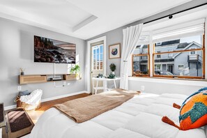 1 bedroom, desk, iron/ironing board, travel crib