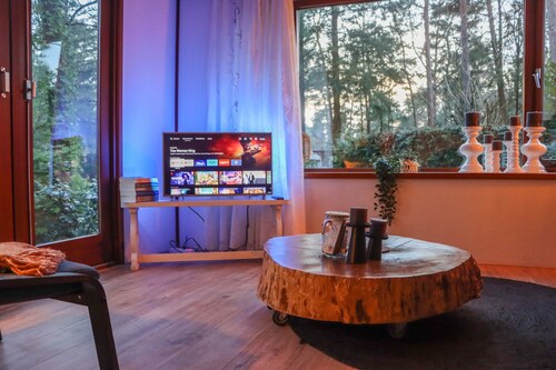 Tranquil forest chalet by pond in Veluwe, pet-friendly & sleeps 4