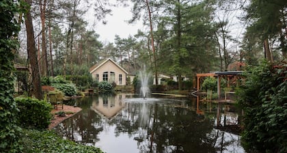 Tranquil forest chalet by pond in Veluwe, pet-friendly & sleeps 4
