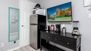 A kitchenette with a refrigerator, microwave, toaster, coffee maker, and blender. - Short Walk to Wilton Drive! Apt5 (Wilton Manors)