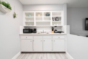 Microwave, stovetop, coffee/tea maker, toaster