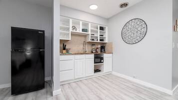 Fridge, microwave, stovetop, coffee/tea maker