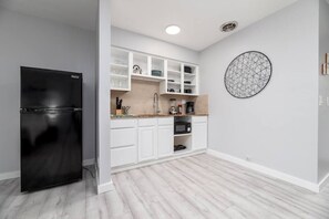 Fridge, microwave, stovetop, coffee/tea maker