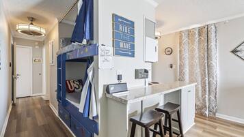 1 bedroom, desk, iron/ironing board, travel crib