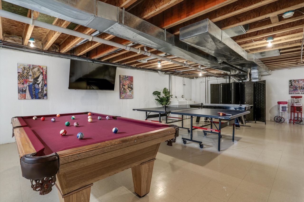 Rack `em up and cue the fun! Step into this lively space, where the billiards table awaits with cue chalk and a lineup of sleek pool sticks. It`s time to break, strategize, and show off your skills in an epic game of billiards.
