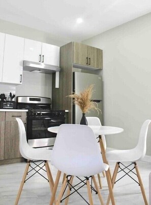 Enjoy cooking in this well-equipped kitchen with a central island and stainless steel appliances.
