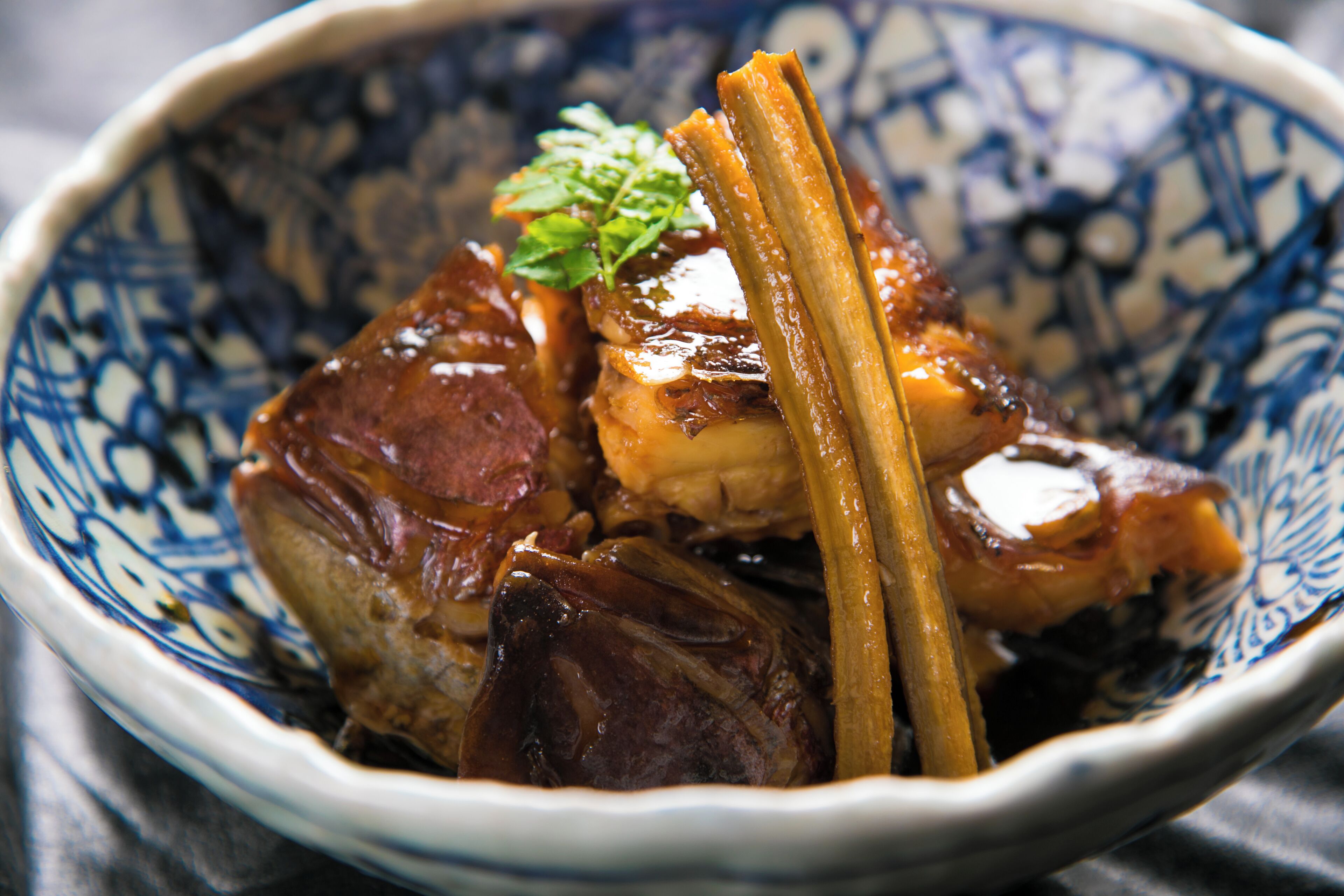 A bowl of food with a decorative blue and white pattern.