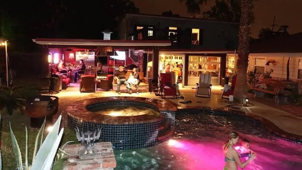 A house with a hot tub, outdoor seating, and a pool. - Lake Charles #1 Rental located close to everything. Casino's/mall/restaurants.  (Lake Charles)
