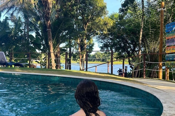 Outdoor pool, open 9:00 AM to 8:00 PM, pool umbrellas, pool loungers