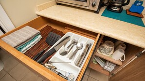 A kitchen drawer with utensils, a spatula, a knife, and a coffee maker. - *Free Parking*Beautiful Views*10 Min to Beach* (Honolulu)