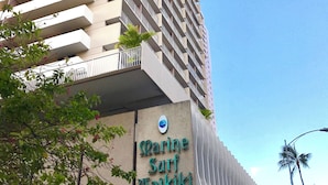 A tall building with a sign reading "Marine Surf Waikiki". - Newly Updated*Free Parking*Full Kitchen*Close to Beach (Honolulu)