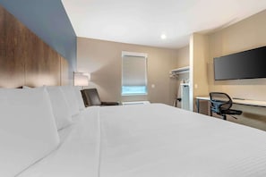 Premium bedding, desk, laptop workspace, iron/ironing board