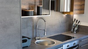 A modern kitchen with a stainless steel sink, a built-in oven, and a sleek countertop. - Villa Imperia 3 (Kvarner - Vrh) (Vrh)
