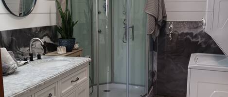 Shower, hair dryer, towels, soap