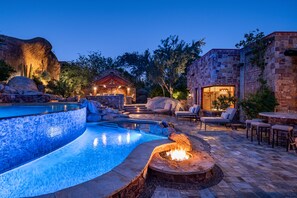 As the sun sets, this extraordinary desert retreat comes to life with glowing pool lights, inviting fire features, and luxurious outdoor lounging, creating the perfect setting for unforgettable evenings beneath the stars. - Castle On Black Mountain, breathtaking panoramic views and outdoor entertainment! (Carefree)