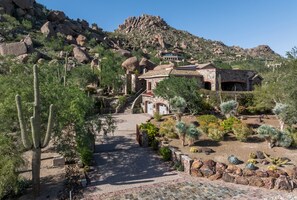 Discover a luxurious desert retreat nestled among dramatic rock formations, offering breathtaking mountain views and stunning natural surroundings. - Castle On Black Mountain, breathtaking panoramic views and outdoor entertainment! (Carefree)