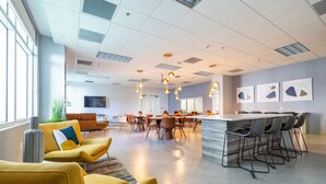 A modern interior with a dining area, bar, and seating. - Miami Brickell unit Balcony Pool 1 pkg (Miami)
